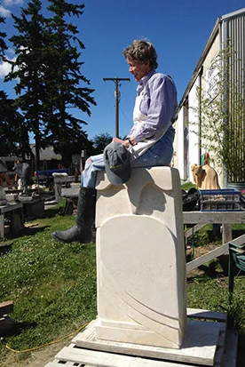 Penelope Crittenden sitting on large sculpture crop